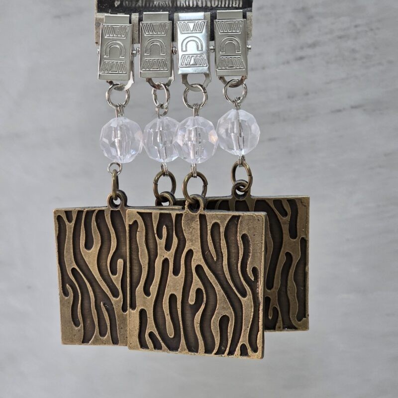 Pesas de mantel x4 animal print metal bronce